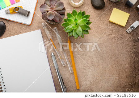 Notepad and succulents on the table. The Business 55185510