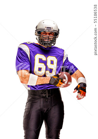 American football player posing with ball on black background. Super Bowl concept. Concept American American football player posing with ball on black background. Super Bowl concept. Concept American 55186538
