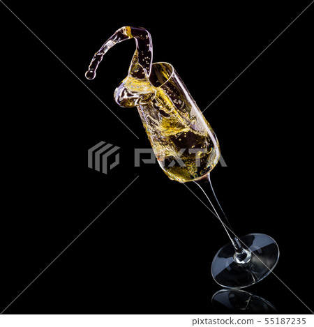 Glass for champagne with bubbles and splashes isolated on black background. Glass for champagne with bubbles and splashes isolated on black background. 55187235