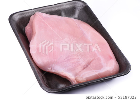 Raw turkey fillet in a plastic tray over 55187322