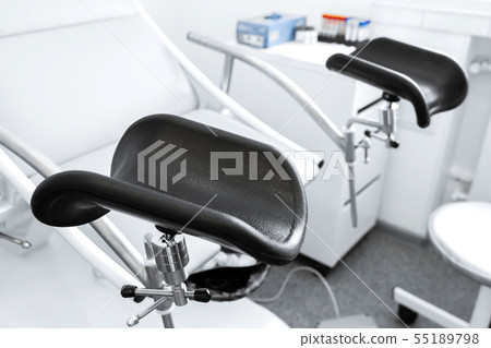 gynecological chair in a light gynecologist's 55189798