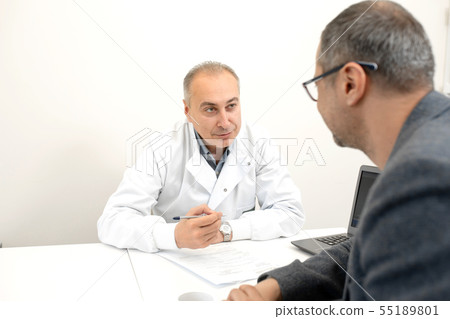 doctor urologist advises a male patient in clinic doctor urologist advises a male patient in clinic 55189801