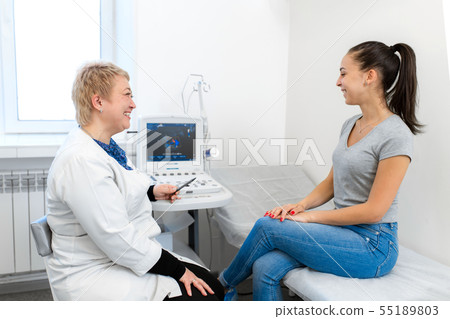 Professional doctor advises the patient young girl Professional doctor advises the patient young girl 55189803