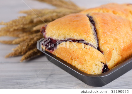 butter blueberry cake in metal black pan on wooden 55190955