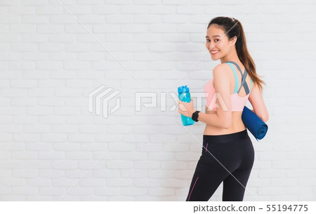 Asian beautiful women holding water bottle and yog 55194775