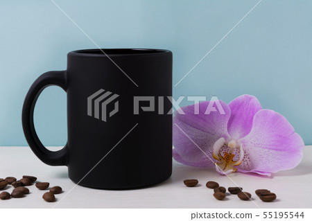 Black mug mockup with orchid and coffee beans Black mug mockup with orchid and coffee beans 55195544