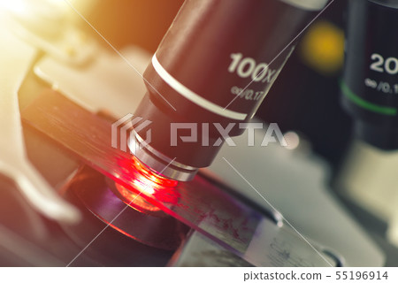 Microscope in medical laboratory analyzing a test 55196914