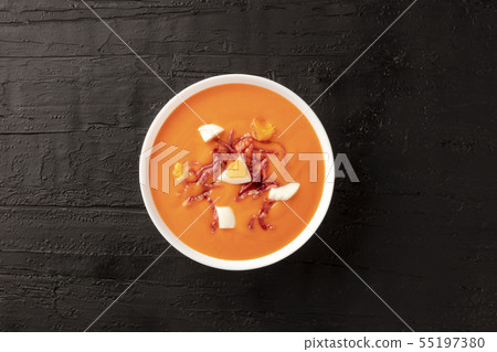 Salmorejo, Spanish cold tomato soup, shot from above on a black background 55197380