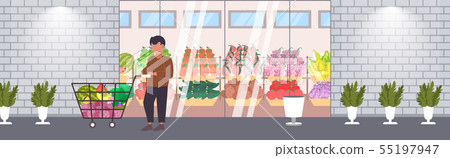 man customer pushing trolley cart with groceries vegetables and fruits shopping concept modern man customer pushing trolley cart with groceries vegetables and fruits shopping concept modern 55197947
