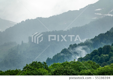 High mountains with forested slopes and peaks High mountains with forested slopes and peaks 55198394
