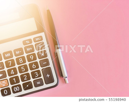Calculator and pen on pink background Calculator and pen on pink background 55198940