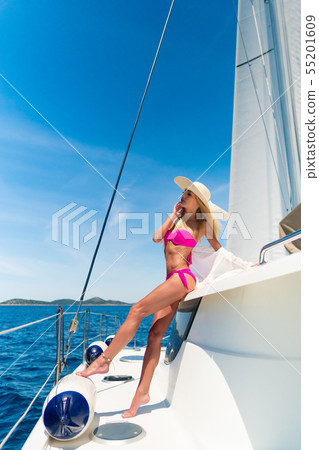 beautiful sexy woman in swimwear relaxing on a yacht beautiful sexy woman in swimwear relaxing on a yacht 55201609