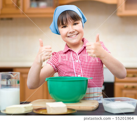Girl is cooking in kitchen 55201964