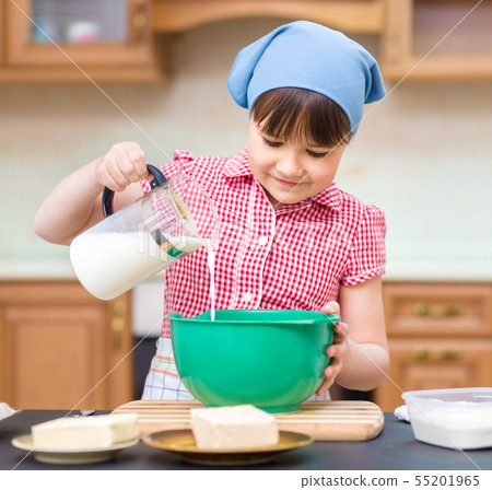 Girl is cooking in kitchen 55201965
