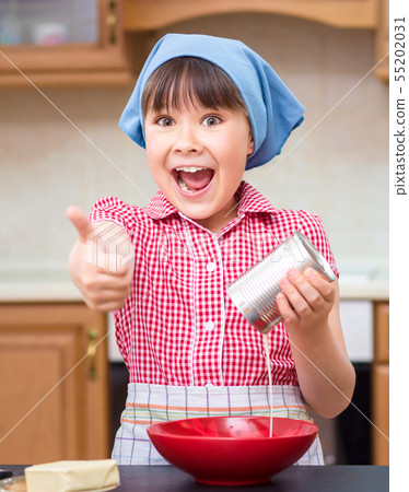 Girl is cooking in kitchen 55202031