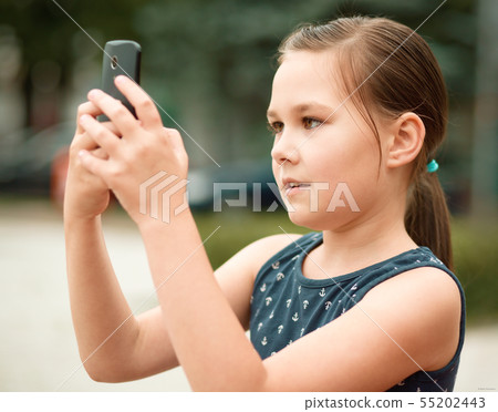 Girl is using smartphone 55202443