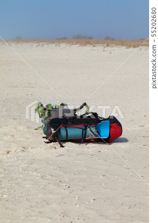 Two big backpacks with sleeping pad on sand beach Two big backpacks with sleeping pad on sand beach 55202680