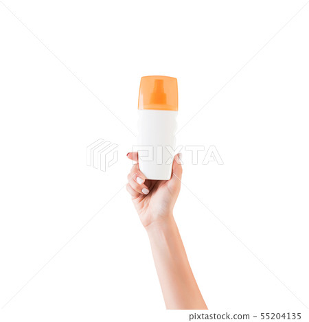 Female hand holding cream bottle of lotion 55204135