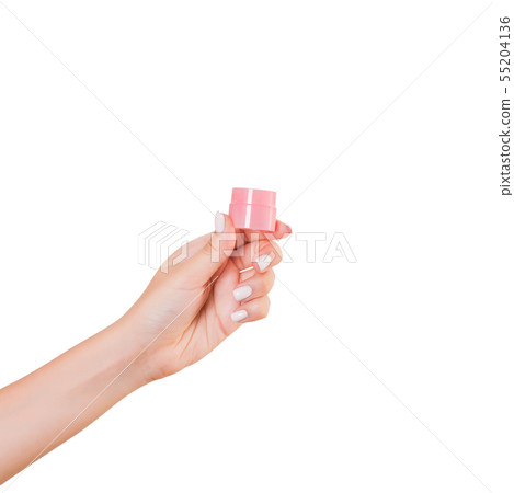 Female hand holding cream bottle of lotion 55204136