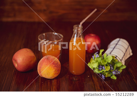 Fresh juice in bottle on wooden table Fresh juice in bottle on wooden table 55212289