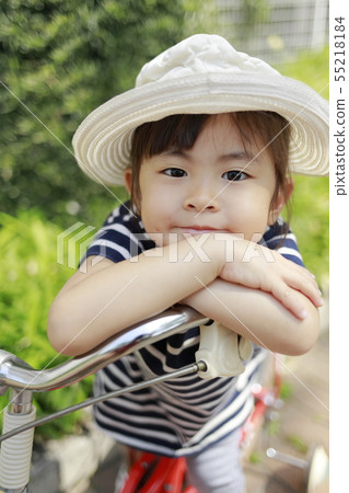 Toddler riding a bicycle (4 years old) Toddler riding a bicycle (4 years old) 55218184