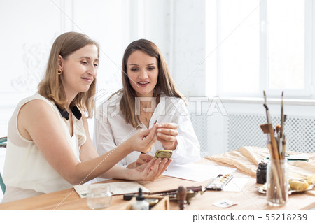 Learning calligraphy in art workshop. Teacher and students. Art school handwriting. Learning calligraphy in art workshop. Teacher and students. Art school handwriting. 55218239