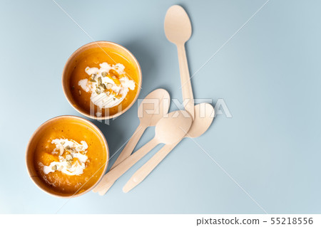 Top view of pumpkin soup in eco craft paper tableware Top view of pumpkin soup in eco craft paper tableware 55218556