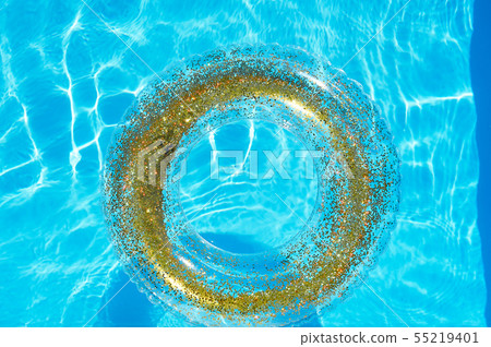 Blue water in the pool and a transparent circle with gold sequins.The atmosphere of rest on the sea 55219401