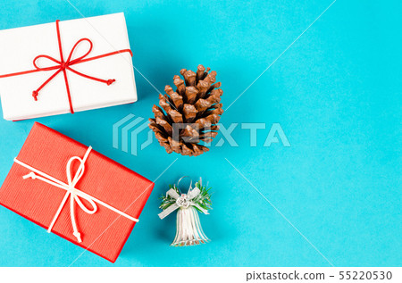 Gift boxs and pine cornes on blue background. 55220530
