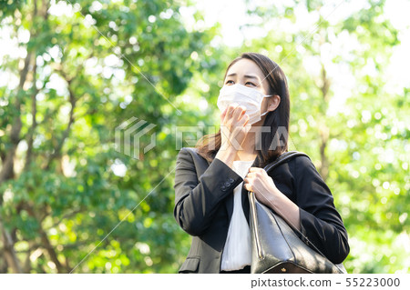 Business woman in a mask Business woman in a mask 55223000