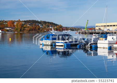 Boats and yachts moored in Norwegian town 55223741