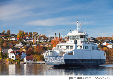 White ferry enters the port of Norwegian town 55223749