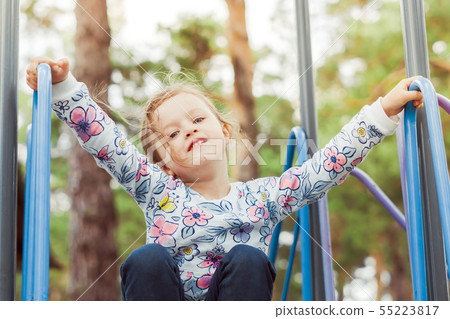 the child plays on the Playground the child plays on the Playground 55223817