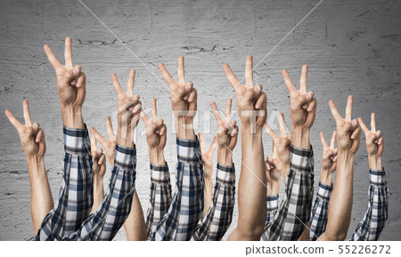 Row of man hands showing victory gesture 55226272