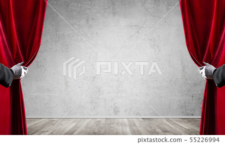 Concrete wall behind drapery curtain and hand opening it Concrete wall behind drapery curtain and hand opening it 55226994
