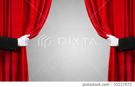 Concrete wall behind drapery curtain and hand opening it Concrete wall behind drapery curtain and hand opening it 55227072