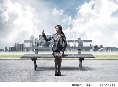 Business woman taking selfie photo or chatting Business woman taking selfie photo or chatting 55227543