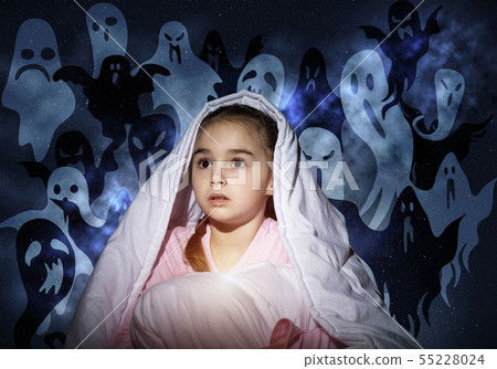 Scared girl with pillow hiding under blanket Scared girl with pillow hiding under blanket 55228024