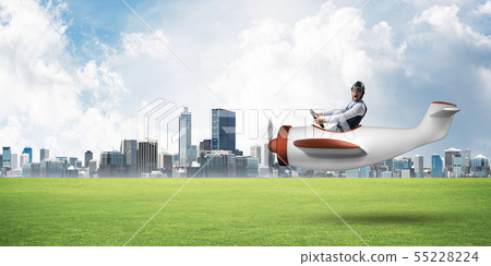 Happy aviator driving small propeller plane Happy aviator driving small propeller plane 55228224