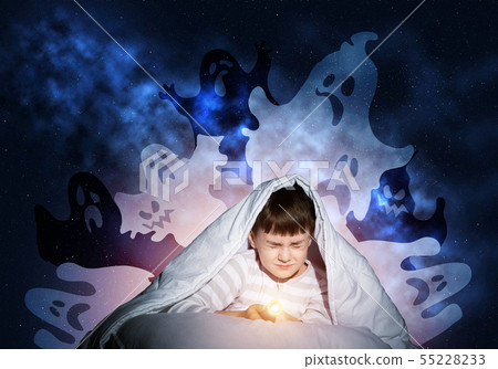 Scared boy hiding under blanket 55228233