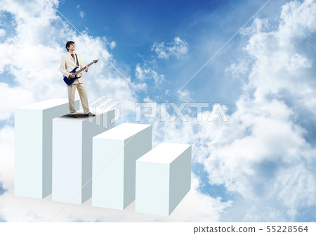 Businessman playing guitar Businessman playing guitar 55228564