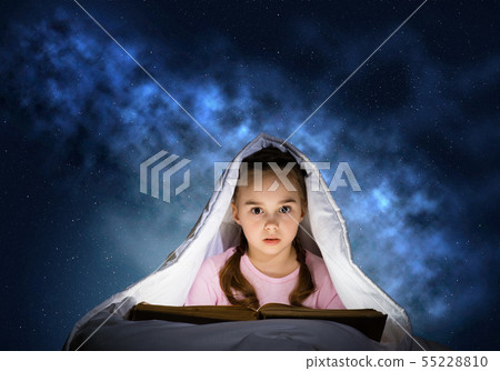 Little girl reading book in bed 55228810