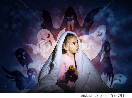 Worried girl hiding under blanket 55229331