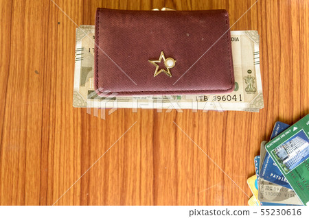 Indian currency cash rupee in brown ladies purse 55230616