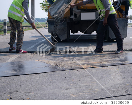 Builders pouring cement during Upgrade to Builders pouring cement during Upgrade to 55230669