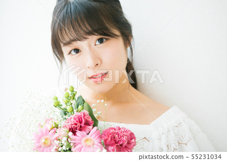 Young woman and flower Young woman and flower 55231034