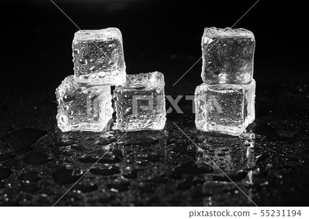 ice cubes on black table background. ice cubes on black table background. 55231194