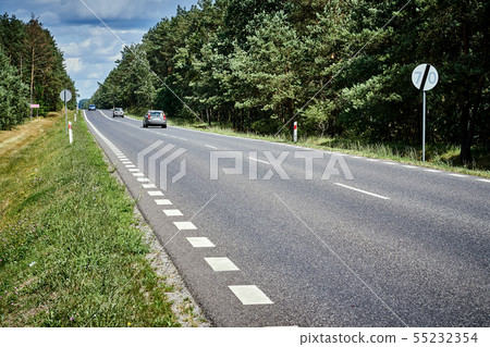beautiful black asphalt road in the green forest in summer beautiful black asphalt road in the green forest in summer 55232354