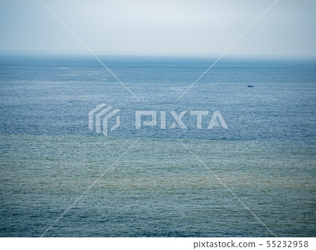 Calm sea surface with boat 55232958