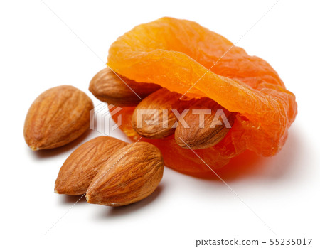 Dried apricots with almonds isolated Dried apricots with almonds isolated 55235017